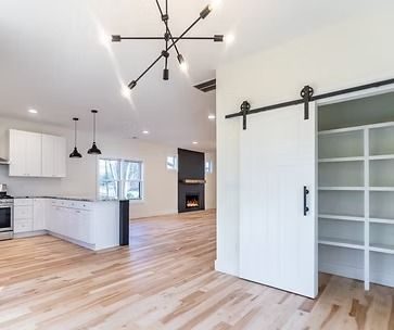 Open kitchen with a sliding barn-door pantry